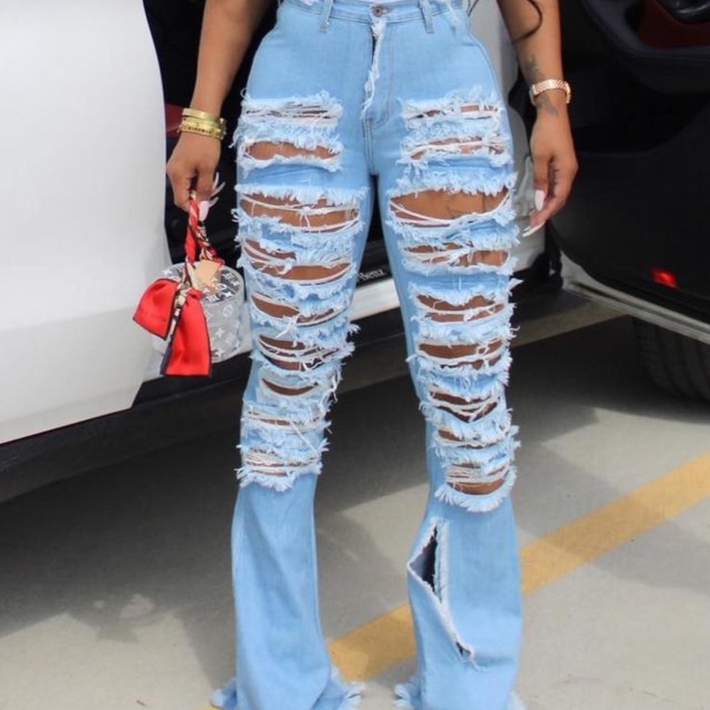 Swankaposh distressed medium wash jeans.